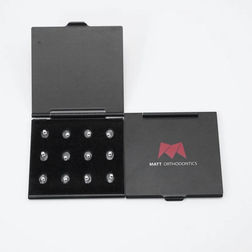 Matt dot lingual button | Matt Orthodontic